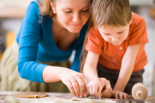 Mom and son decorating cookies