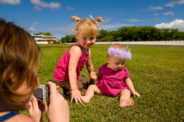 Mom photographing daughters