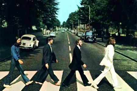 The Beatles walk Abbey Road