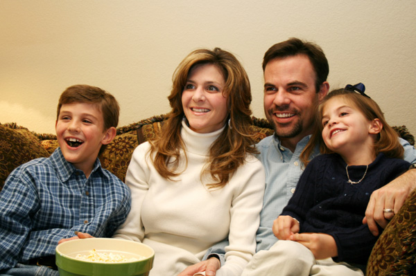 Family watching movies together