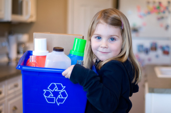Little girl recycling