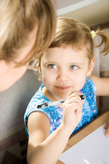 Little girl writing list