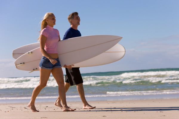 Man and woman surfing