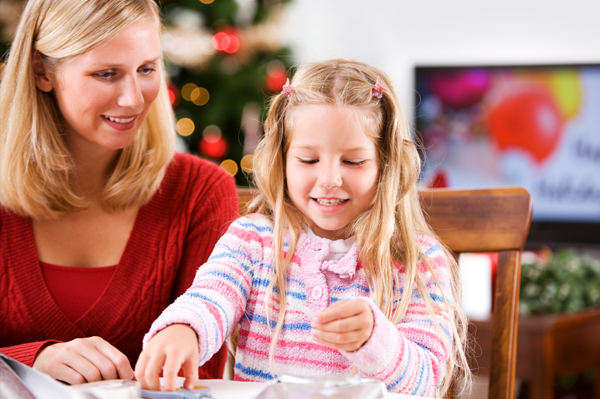 Mom doing Christmas crafts with daughter