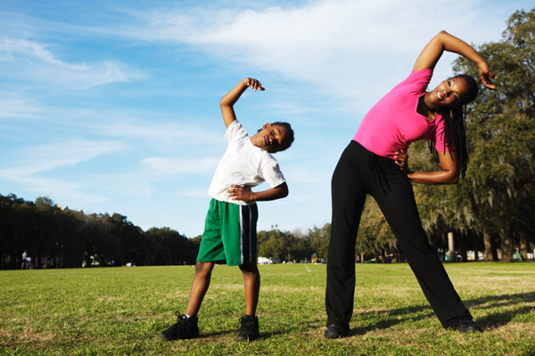 Mother and son exercising together