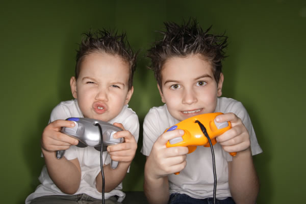 Little boys playing video game