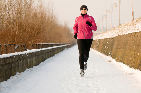 Woman running in snow
