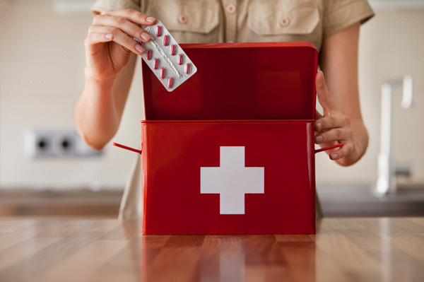 Woman with first aid kit