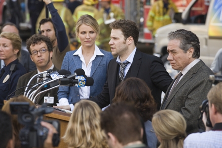Cameron Diaz listens to Seth Rogen in The Green Hornet