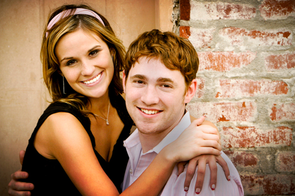 Smiling, happy couple hugging.