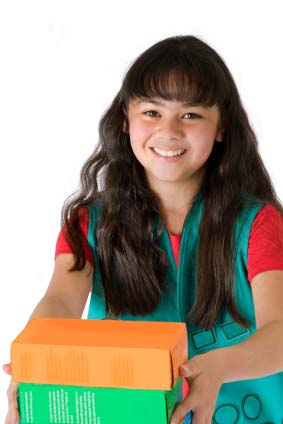 Girl scout selling cookies