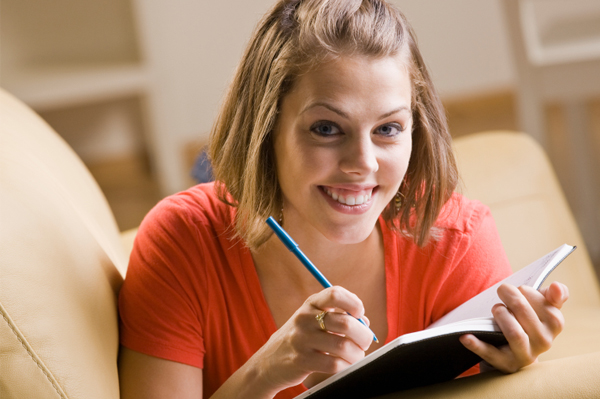 Woman writing in journal