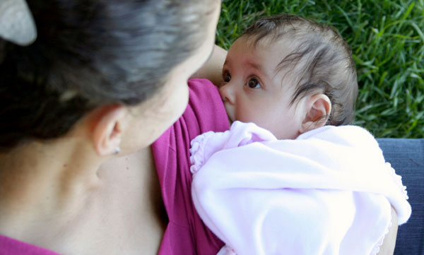 public breastfeeding baby nursing in the park