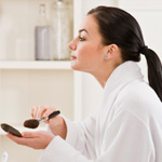 Woman applying makeup
