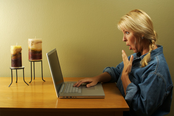 shocked woman on computer