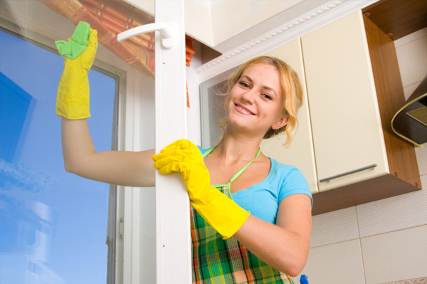 Woman cleaning windows