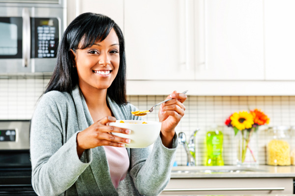 Woman eating healthy cereal