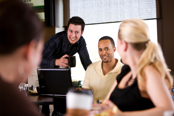 Woman flirting with men in cafe