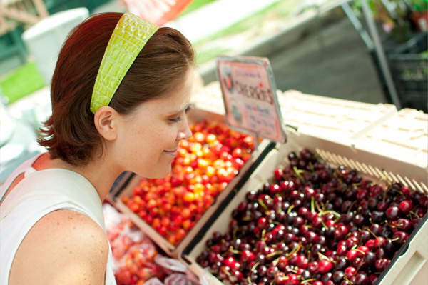 Woman eating organic cherries