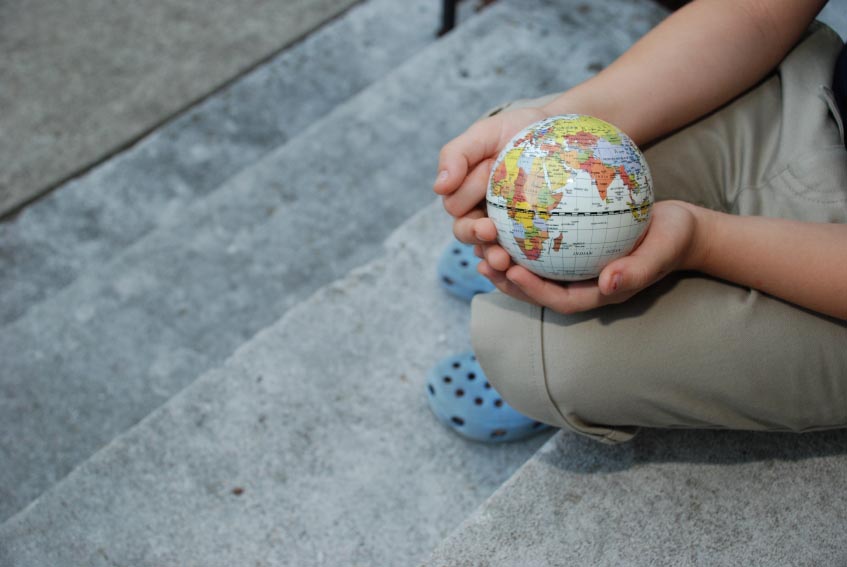 child holding globe
