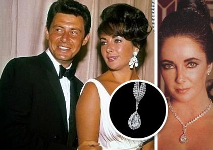 Elizabeth Taylor wearing diamond earings next to Eddie Fisher