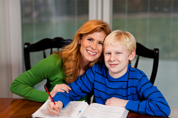 Mom helping son with homework