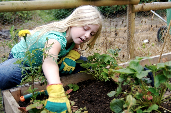 tween girl gardening