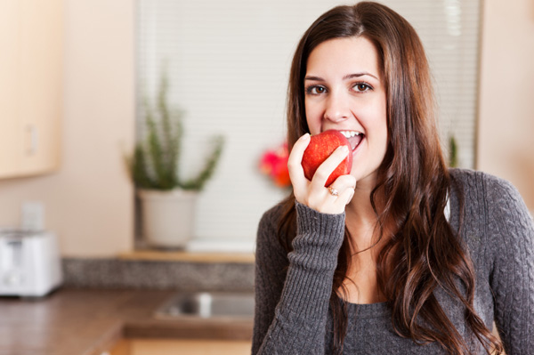 Woman eating apple