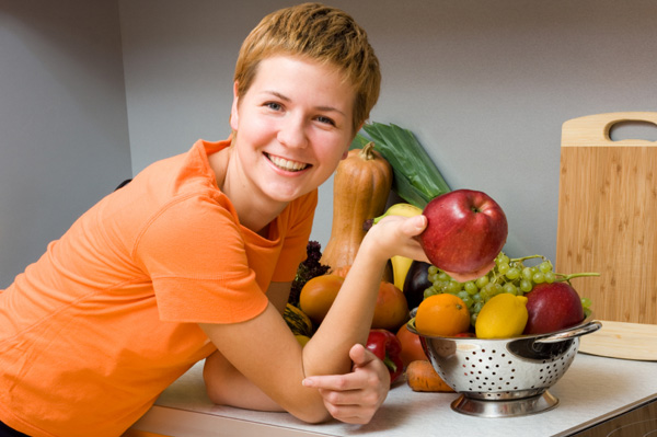 Woman with fruit bowl