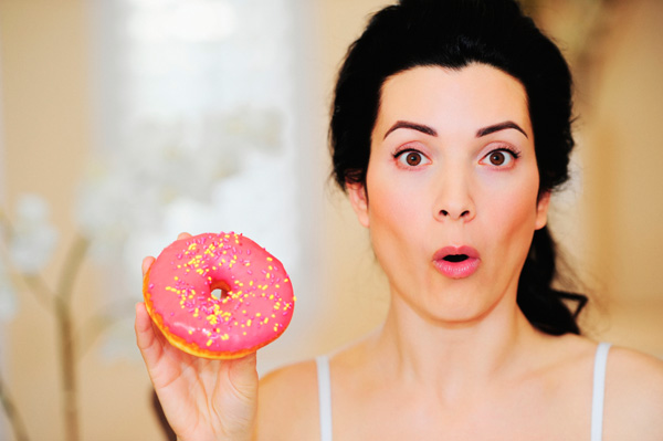 Woman with sugary donut