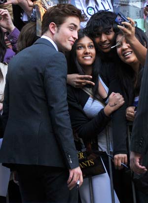 Robert Pattinson signs autographs for fans