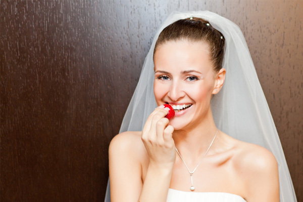 Bride snacking on fruit