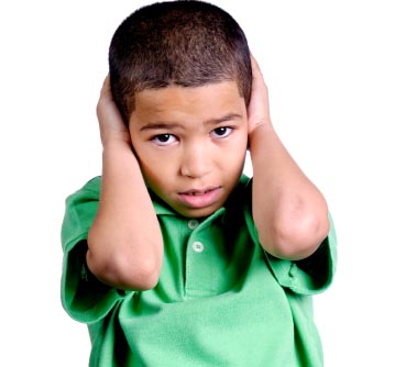 child covering ears