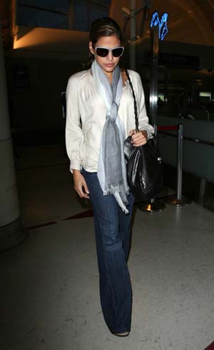 Eva Mendes leaving LAX in flare jeans