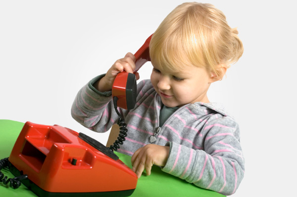 girl with toy telephone