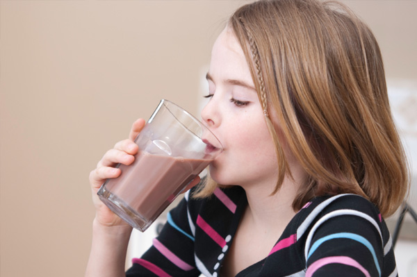 Girl drinking chocolate milk