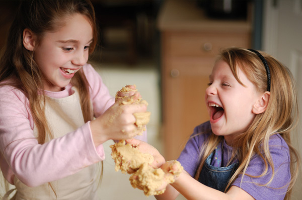 Kids making peanut butter playdough