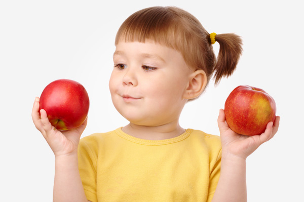 Little girl counting apples