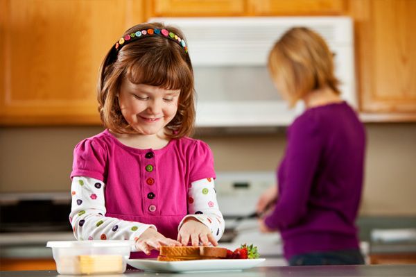 Little girls making sandwich
