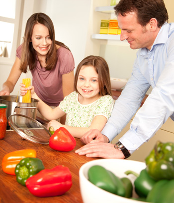 Mom and dad and daughter cooking