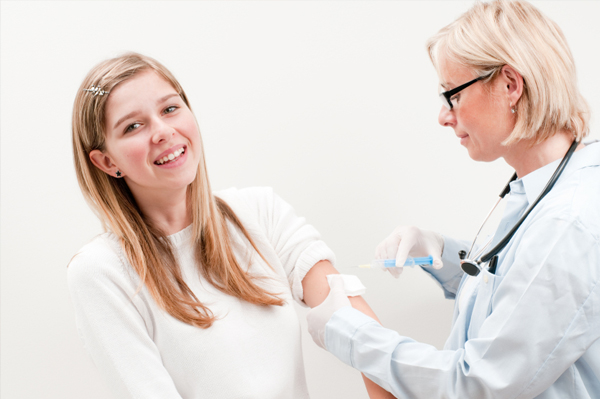 Teen getting vaccinated