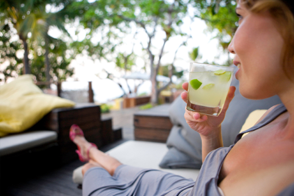 Woman drinking mojito