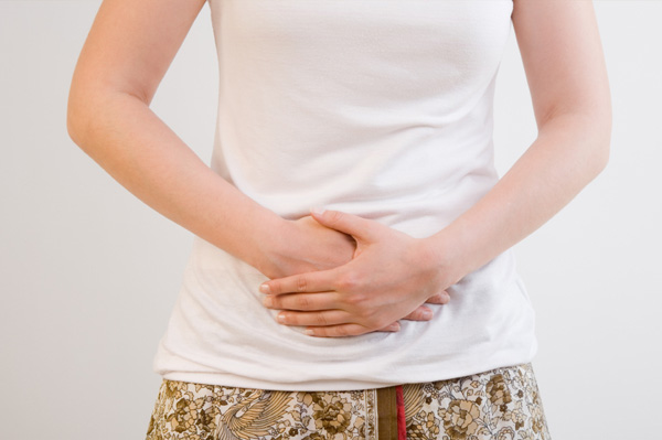 Woman with stomach pains