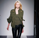 woman modeling military fashion trend on runway