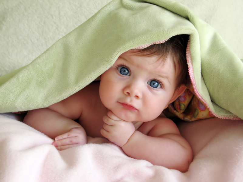 images of babies girl. baby-girl-under-blanket