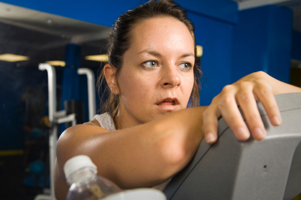 Exhausted woman in gym