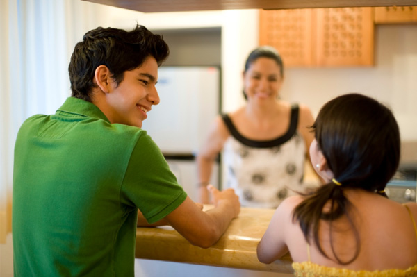 Family in kitchen with bar