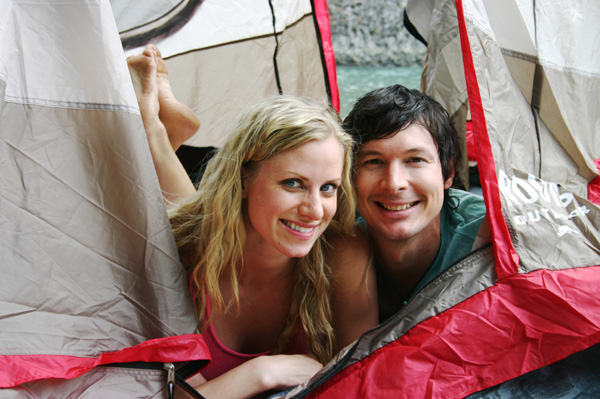 Happy couple camping together