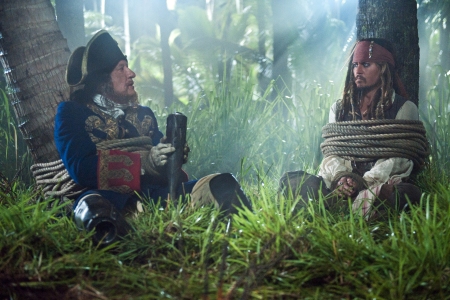 Johnny Depp and Geoffrey Rush in Pirates of the Caribbean: On Stranger Tides