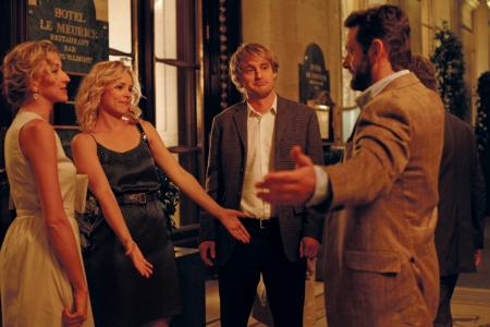 Michael Sheen greets Rachel McAdams and Owen Wilson in Midnight in Paris